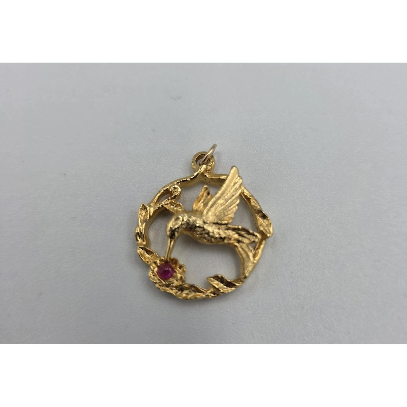 Jji Goldtone Hummingbird Pendant With Red Rhinestone Flower